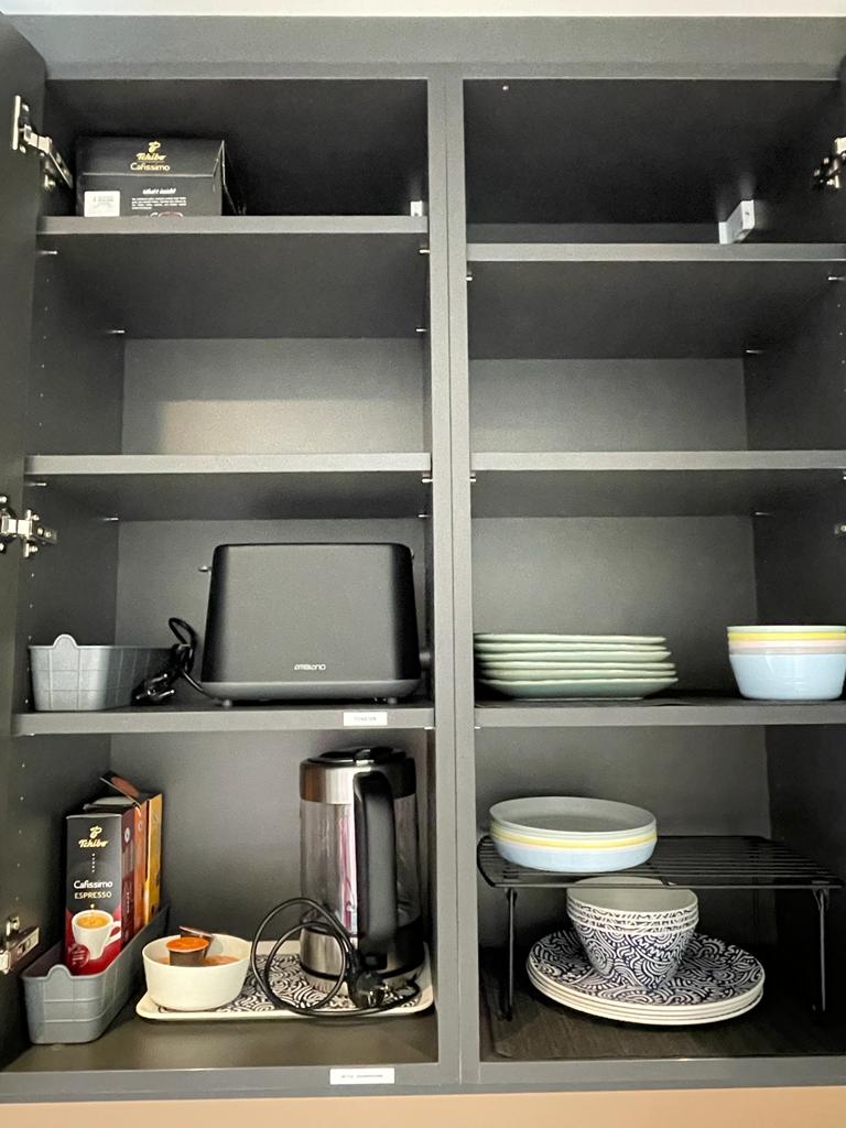 Cupboard with complete crockery, toaster and kettle