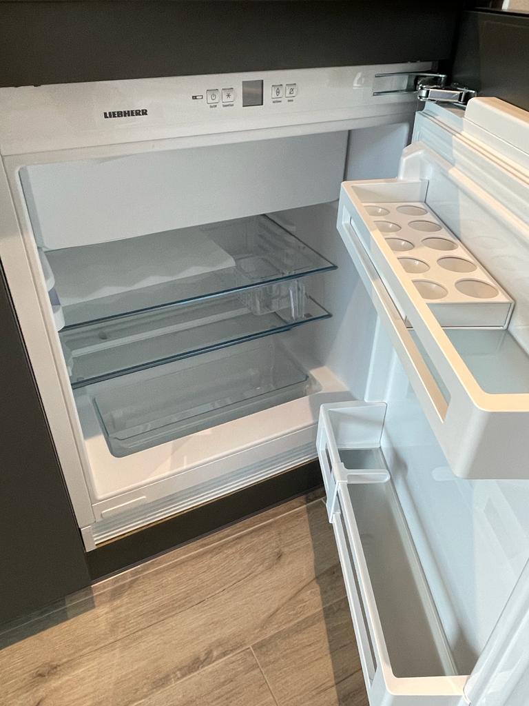 Integrated fridge with freezer compartment